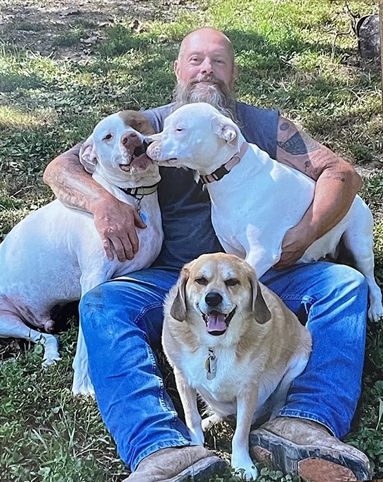 Owner Paul Rippetoe and his three dogs